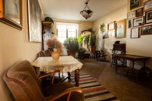 a living room with a table and chairs at Modryna Ranczo in Krasiczyn