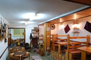 a room with tables and chairs and a room with tables at Villa Flora in Ohrid +35 photos