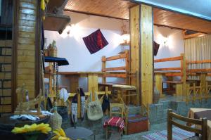 a room with tables and chairs in a building at Villa Flora in Ohrid