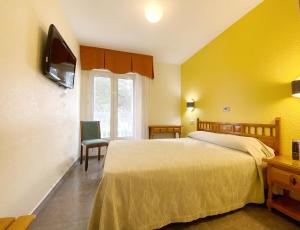 Postel nebo postele na pokoji v ubytování Hotel La Colina