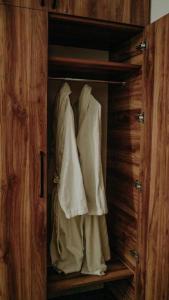 a closet with white towels hanging in it at Area Park Bakuriani in Bakuriani