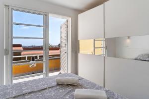 Postel nebo postele na pokoji v ubytování Moderno Triplex Sonneland