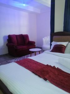 Postel nebo postele na pokoji v ubytování CBD Nakuru luxurious Studio-Nash
