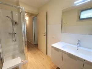a bathroom with a shower and a sink and a mirror at Antica Stresa in Stresa +41 photos