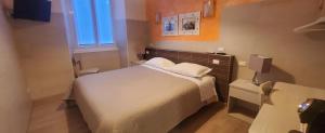 Postel nebo postele na pokoji v ubytování Albergo Annabella