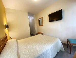 TV a/nebo společenská místnost v ubytování Hotel La Colina