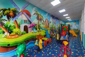 a childrens play room with a mural on the wall at Narcissus Obhur Resort & Spa in Jeddah