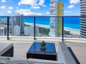 a balcony with a view of the beach and ocean at 29th floor Oracle Tower 2 stunning ocean and city views in Gold Coast