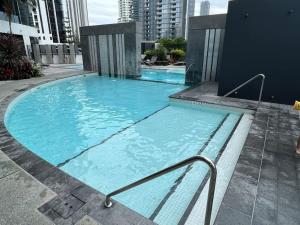 a large swimming pool in the middle of a building at 29th floor Oracle Tower 2 stunning ocean and city views in Gold Coast