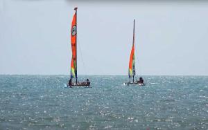two sailboats in the middle of the ocean at Camping Les Perouses in Saint-Clément-des-Baleines