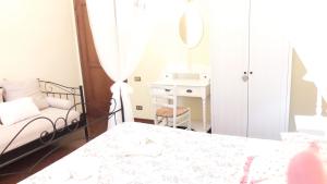 Postel nebo postele na pokoji v ubytování B&B Le Mi' Cocche