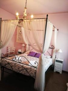 Postel nebo postele na pokoji v ubytování B&B Le Mi' Cocche