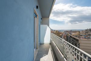 a balcony with a view of a city at Enchanting Panoramic Retreat in Cagliari