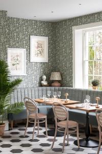 a dining room with a table and chairs at The Royal Crescent Hotel & Spa in Bath
