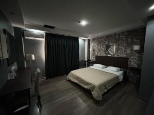 Posteľ alebo postele v izbe v ubytovaní Athina Airport Hotel