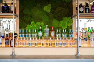 a shelf filled with lots of bottles of alcohol at Tattershall Lakes Country Park in Tattershall