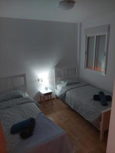Postel nebo postele na pokoji v ubytování Marine de la Torre