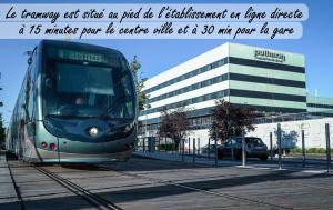 a tram on the tracks in front of a building at Pullman Bordeaux Lac in Bordeaux