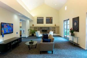 a living room with a couch and chairs and a tv at Sunnyvale 1BR w Pool WD Gym nr Google SFO-733 in Sunnyvale