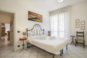 Postel nebo postele na pokoji v ubytování Iris - Sweet Dreams in Florence
