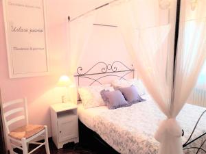 Postel nebo postele na pokoji v ubytování B&B Le Mi' Cocche