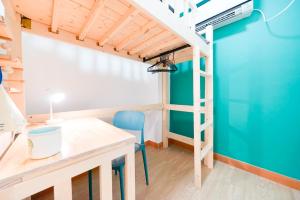 a room with a desk and a loft bed at CoLiving - Lockhart Road 388 in Hong Kong