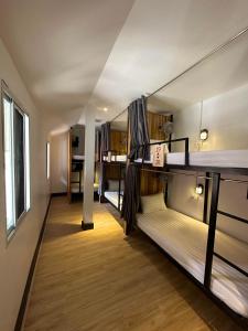 a dorm room with bunk beds in it at Downtown Hostel in Luang Prabang