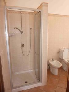 a bathroom with a shower and a toilet at Casa Malandrino in Porto Valtravaglia