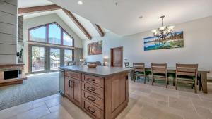 a kitchen and dining room with a table and chairs at Zalanta 325 in South Lake Tahoe