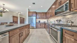 a large kitchen with wooden cabinets and stainless steel appliances at Zalanta 325 in South Lake Tahoe