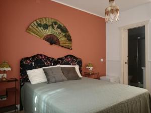 A bed or beds in a room at Colosseum B