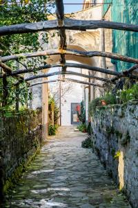 an alley way in an old building with a tunnel at Mirasole House in Massa Lubrense