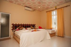 Letto o letti in una camera di Summer Vibes Beach Front