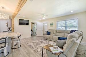 a living room with a couch and a table at Merritt Island Getaway - 8 Mi to Cocoa Beach! in Merritt Island