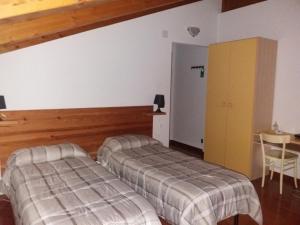En eller flere senge i et værelse på Maggiociondolo
