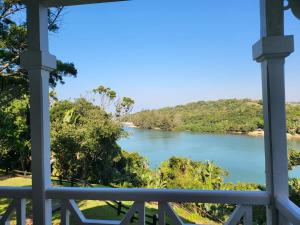 a view of a river from a balcony at Caribbean Estates Montego bay 30 in Port Edward