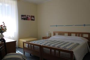 A bed or beds in a room at Hotel Il Nibbio