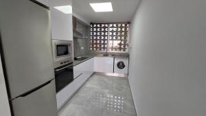 Kuchyňa alebo kuchynka v ubytovaní Ibi Apartamentos la Cantera Peñíscola