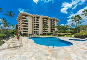 a resort with a swimming pool and a resort at Polo Beach Club Two Bedrooms - Ground Floor by Coldwell Banker Island Vacations in Wailea