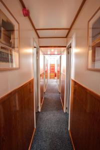 a hallway in an office building with a long corridor at Panta Rhei Classic Hostel Ship in Amsterdam