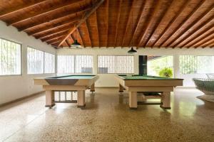 two pool tables in a large room with windows at Finca La Maria: Recreo y naturaleza (22 personas) in Santa Fe de Antioquia