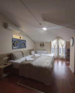 a bedroom with a large bed in a room at Rumeli Konak Butik Otel in Tekirdağ