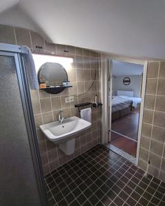 a bathroom with a sink and a shower at Rumeli Konak Butik Otel in Tekirdag