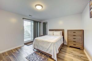 een slaapkamer met een bed en een groot raam bij York Vacation Rental about 7 Mi to Downtown in York