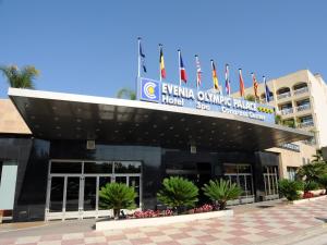 a building with flags on top of it at Evenia Olympic Palace in Lloret de Mar