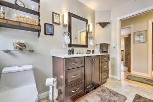 a bathroom with a sink and a toilet and a mirror at Hadley Vacation Rental 24 Mi to Springfield! in Hadley +19 photos