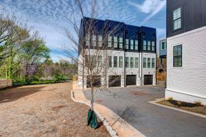 a building with a tree in front of it at Modern Atlanta Townhome Rental about 2 Mi to Downtown! in Atlanta