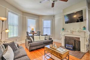 a living room with a couch and a fireplace at Airy Vacation Rental in Augusta, Georgia! in Augusta