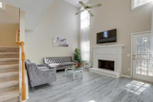 a living room with a couch and a fireplace at Stone Mountain Vacation Rental with Deck! in Stone Mountain