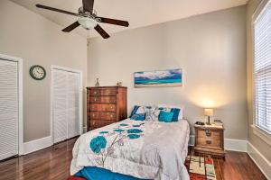 a bedroom with a bed and a ceiling fan at Bright Augusta Vacation Rental, 2 Mi to Riverwalk! in Augusta